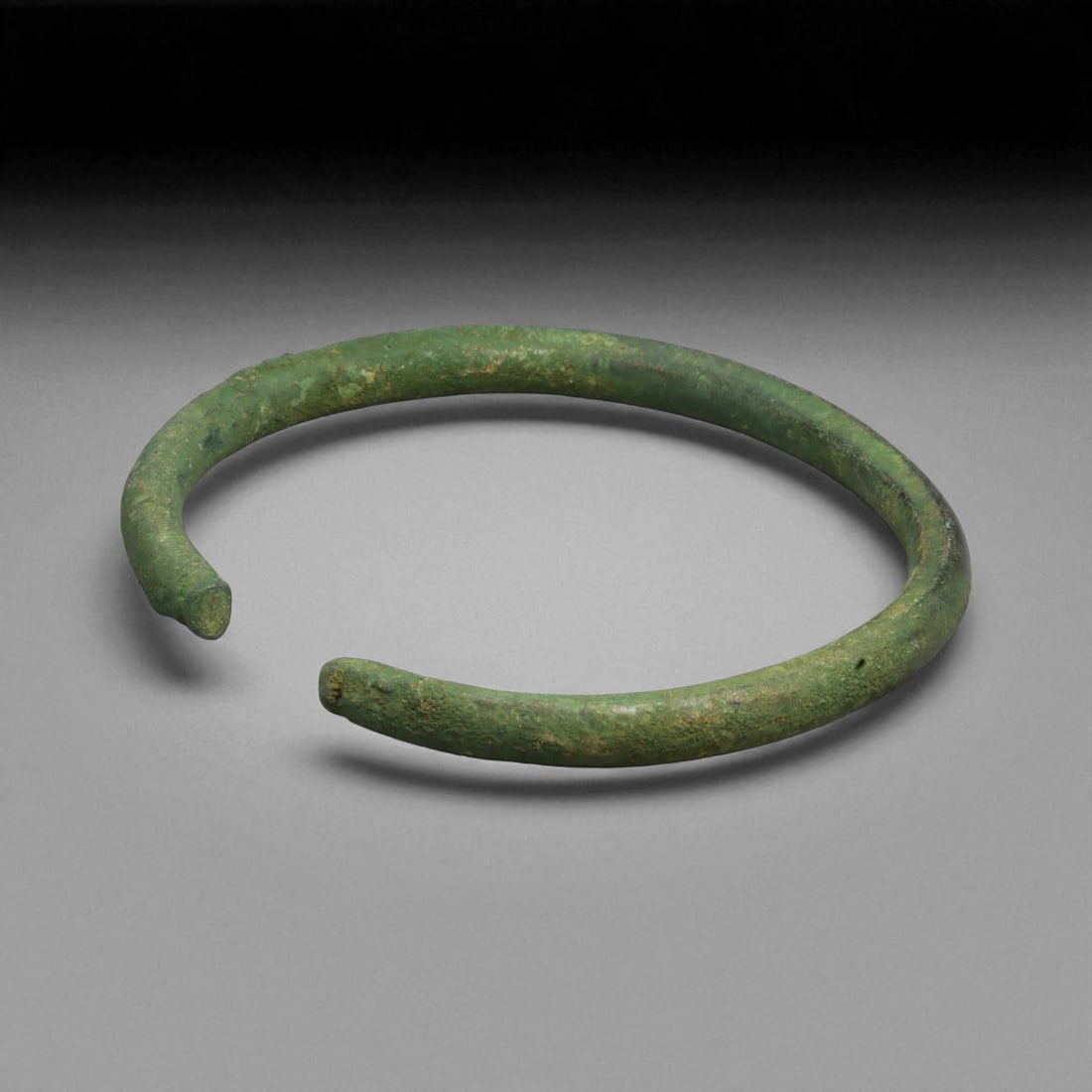 Ancient Roman Bronze Bracelet, c. 1st-3rd Century CE, 9cm, 69g, 23B: This ancient Roman bronze bracelet dates to the height of the Roman Empire, between the 1st and 3rd centuries CE, a time of expansive trade, engineering marvels, and refined metal craftsmanship. Bronz