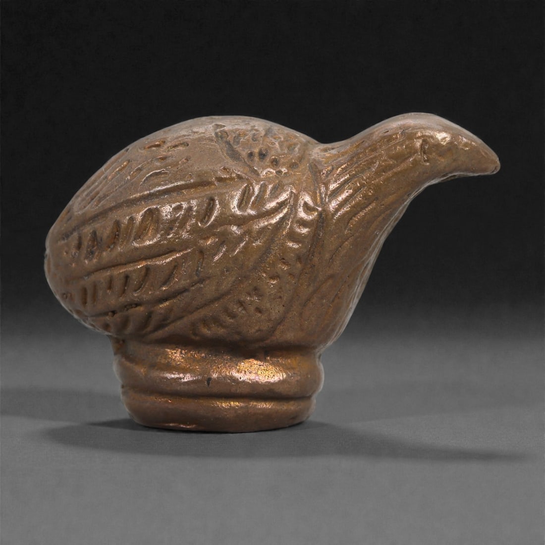 Bronze Bird Figurine - Southeast Asian Animal Icon, 26D: Cast in bronze with a softly burnished surface, this small sculpture depicts a stylized bird poised atop a rounded pedestal base. The body is compact and ovoid, its wings and plumage defined by incise