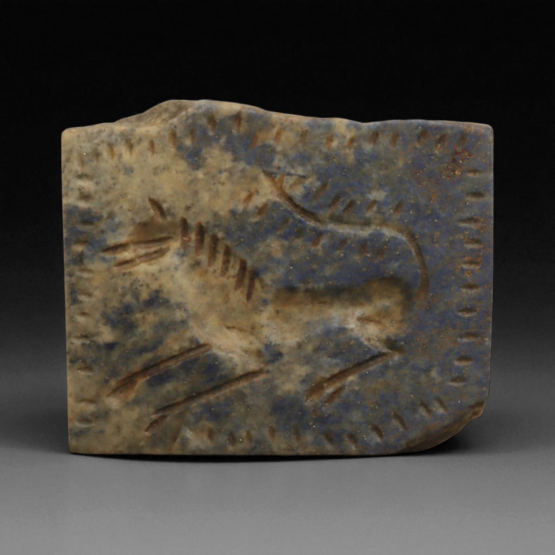 A Neo-Assyrian Lapis Lazuli Plaque with Leaping Horse Relief, c. 8th-7th Century BCE, 6cm, 60BQ: This finely carved lapis lazuli plaque originates from the Neo-Assyrian Empire, which dominated Mesopotamia from 911 to 609 BCE. The Assyrians were masters of monumental art and miniature glyptic trad
