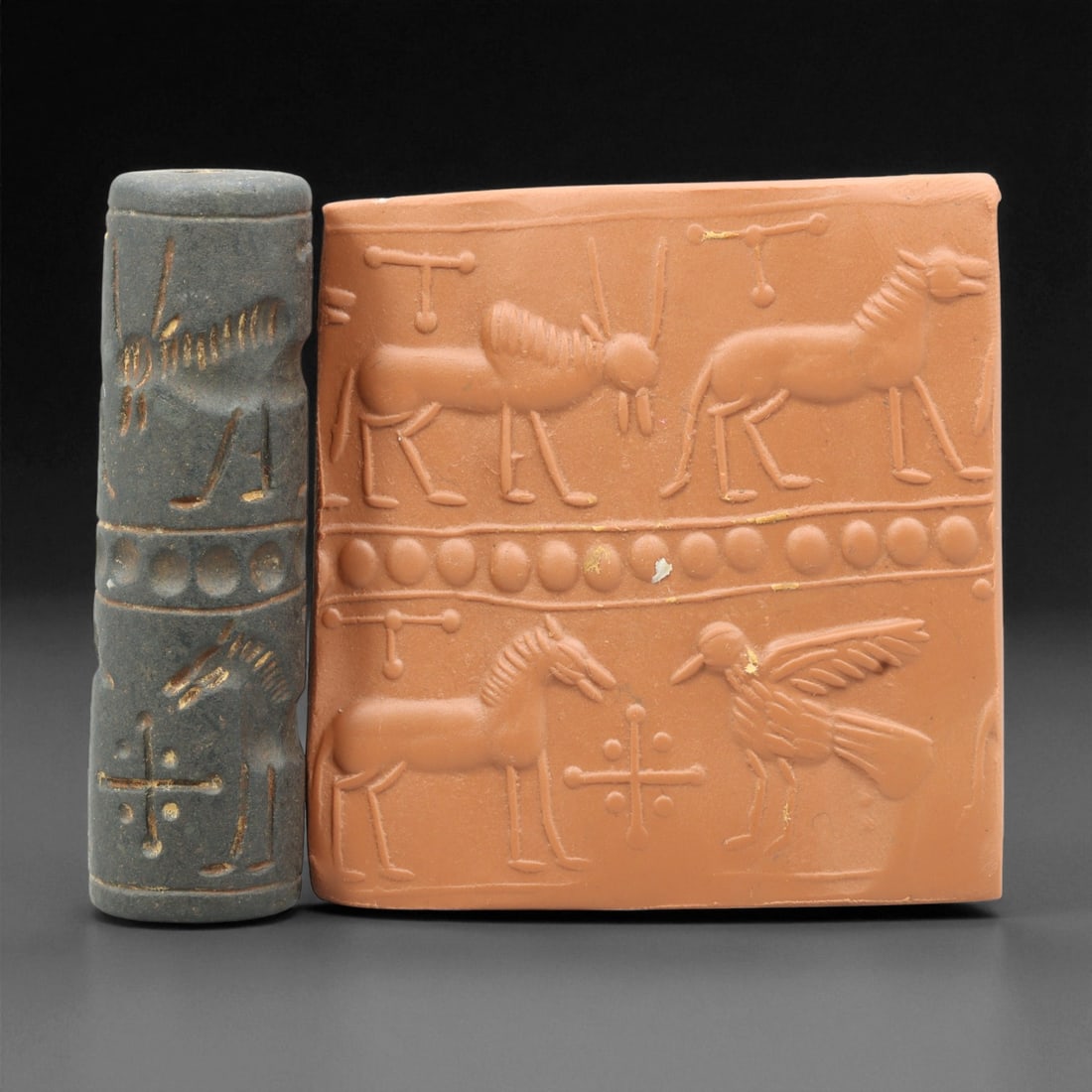 Ancient Mesopotamian Akkadian Steatite Cylinder Seal, c. 2300-2100 BCE, 6.3cm, 41EV: Carved from fine dark steatite, this ancient Akkadian cylinder seal dates to the late 3rd millennium BCE, a period when Mesopotamian artisans perfected the art of miniature relief engraving. Each seal
