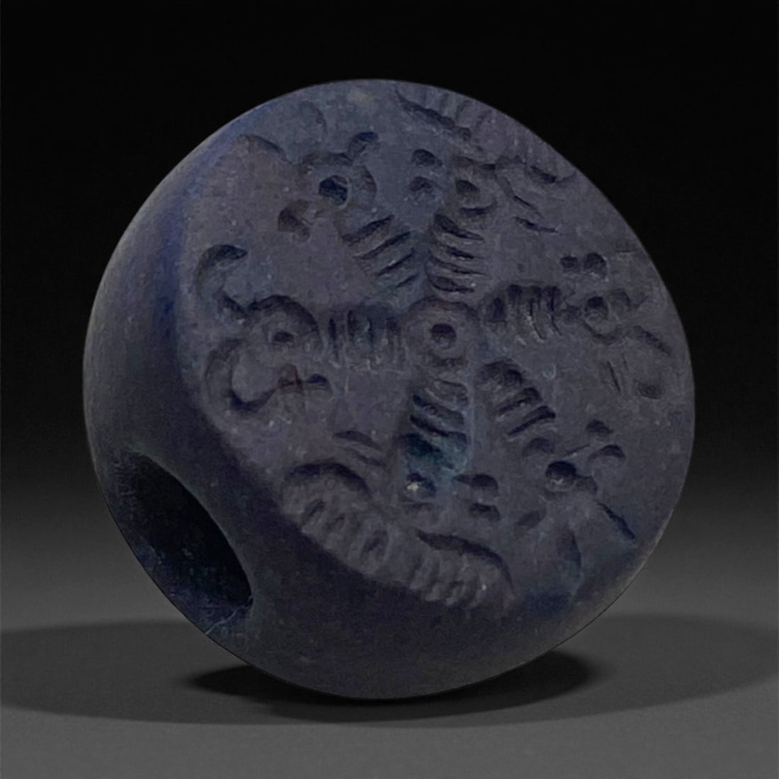 A Sasanian Hemispherical Stone Stamp Seal with Floral Motif, c. 3rd-6th Century CE, 2cm, 13g, 37AA: This hemispherical stamp seal originates from the Sasanian Empire (c. 3rd-6th century CE), a period that marked the pinnacle of Persian artistic and administrative sophistication. Finely carved from a