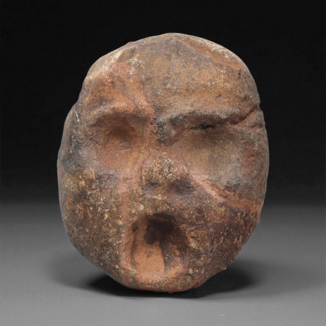 A Mediterranean Stone Maskette, 12th-17th Century, 26LC (1 of 2)