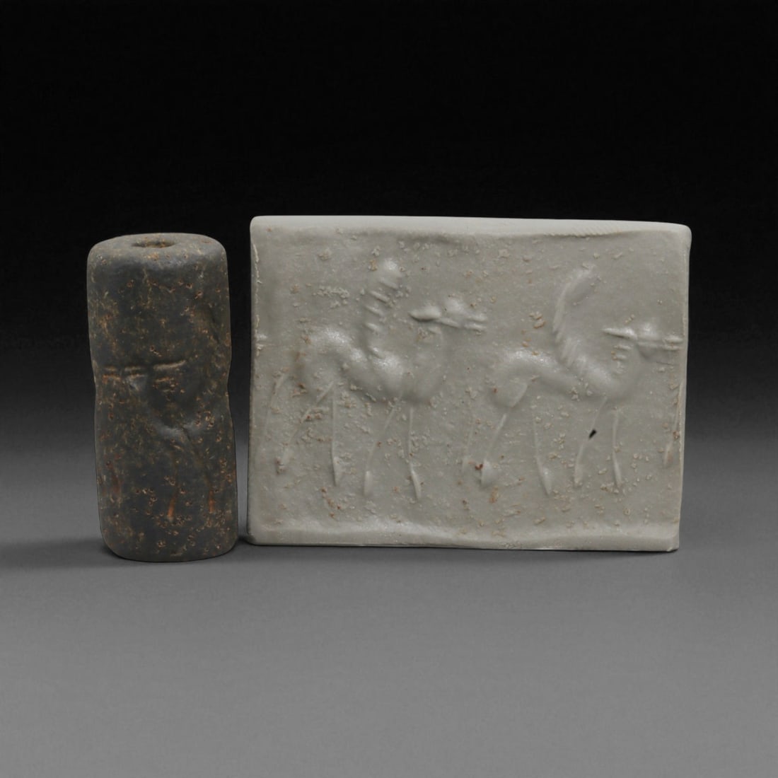 A Mesopotamian Stone Cylinder Seal, 3rd-2nd Millennium BCE, 2.7cm, 39BE: This authentic cylinder seal from ancient Mesopotamia dates to the 2nd to 1st millennium BCE, a time when the art of carving miniature narratives on stone reached remarkable levels of refinement. Seal