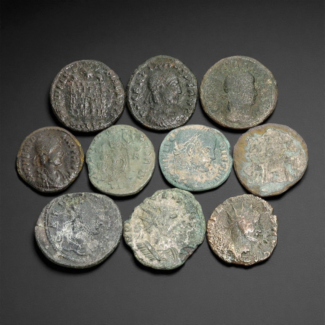 Ancient Roman Imperial Bronze Coins (AE2-AE3 Denominations), c. 3rd-4th Century CE, 14ER: A well-preserved group of nine bronze coins dating from the late Roman Imperial era, spanning approximately the 3rd to 4th century CE. These AE2-AE3 denominations represent a dynamic period of transit
