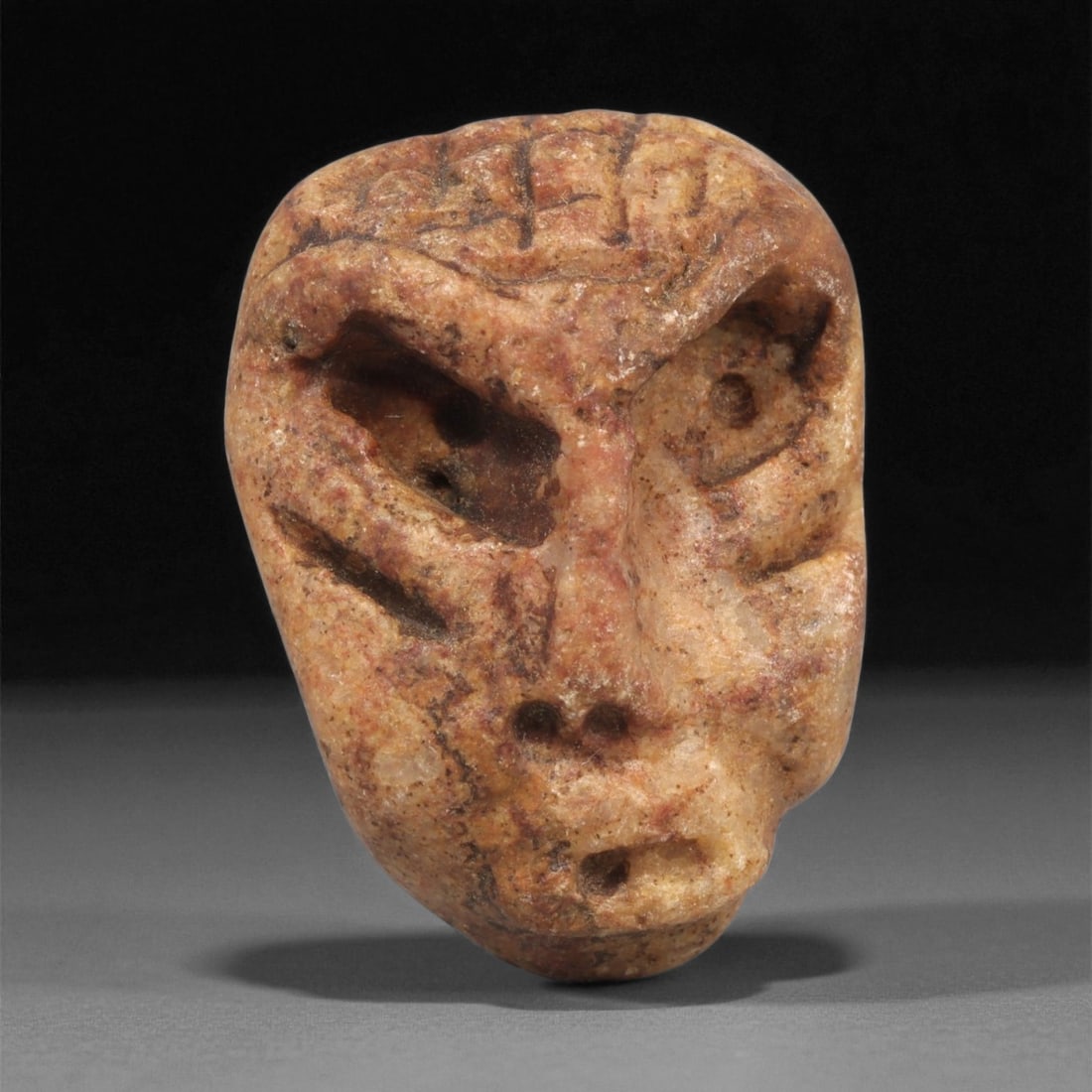 A Mediterranean Stone Maskette, 12th-17th Century, 48LC (1 of 2)