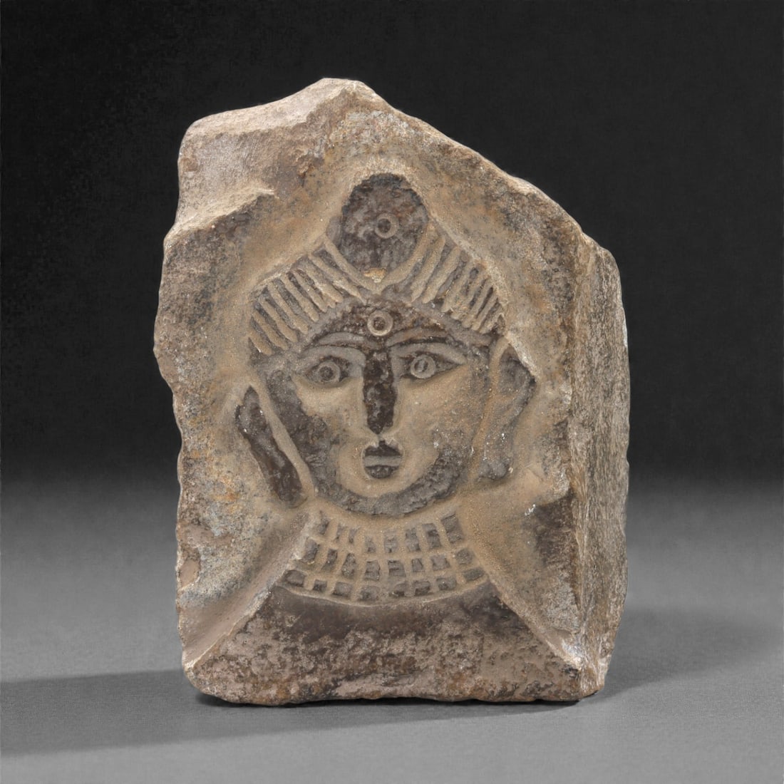 A Gandharan Stone Plaque with Figural Head, 3rd-4th Century CE, 20LN (1 of 2)
