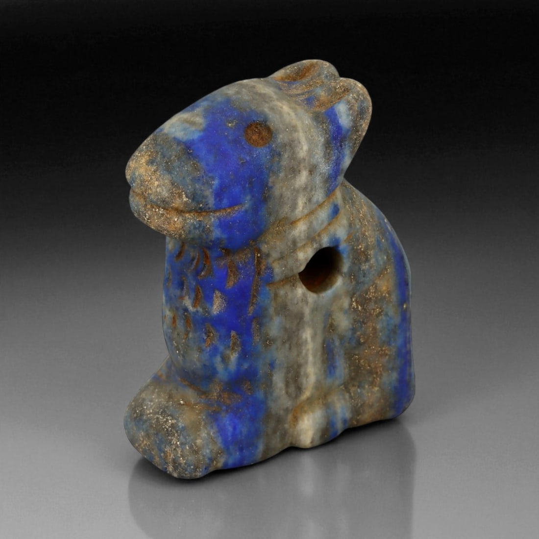 Ancient Bactrian Lapis Lazuli Feline Effigy Amulet, c. 2nd-1st Millennium BCE, H 4cm, 26BF: This finely carved lapis lazuli effigy, depicting a seated feline, originates from the Bactrian civilization of Central Asia, circa 2nd-1st millennium BCE. Compact yet striking in presence, the effigy
