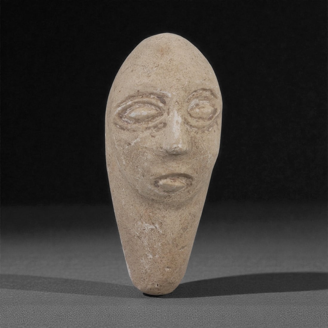 A Bactrian Stone Anthropomorphic Idol Head, 3rd Millennium BCE, 49LP (1 of 4)