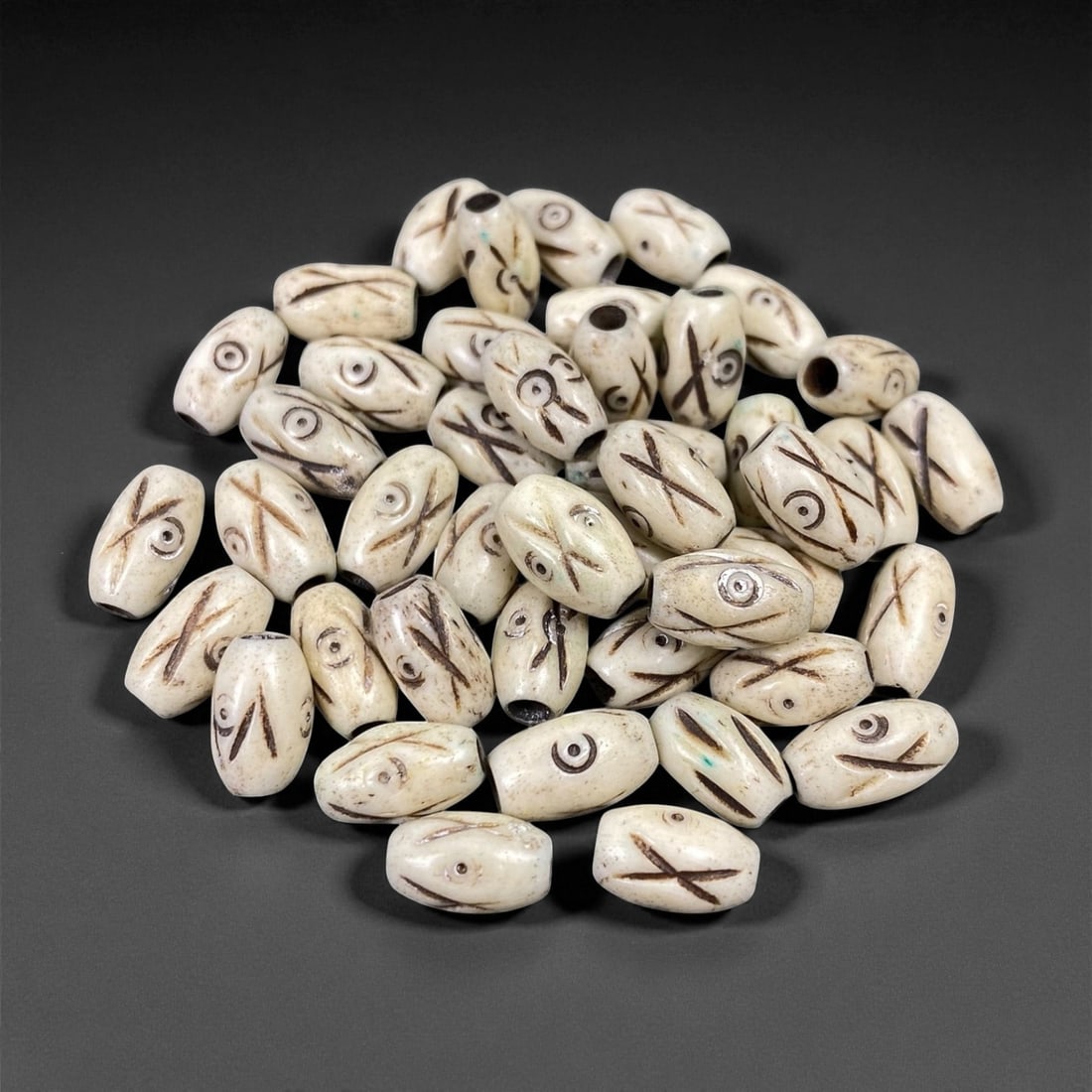 Mid-20th Century Tibetan Hand-Carved Wood Beads, 0.9cm, 18EP: A collection of Tibetan wood beads, each individually carved and polished, showcasing the natural beauty of the dark-stained grain with contrasting pale surface decoration. These mid-century examples 