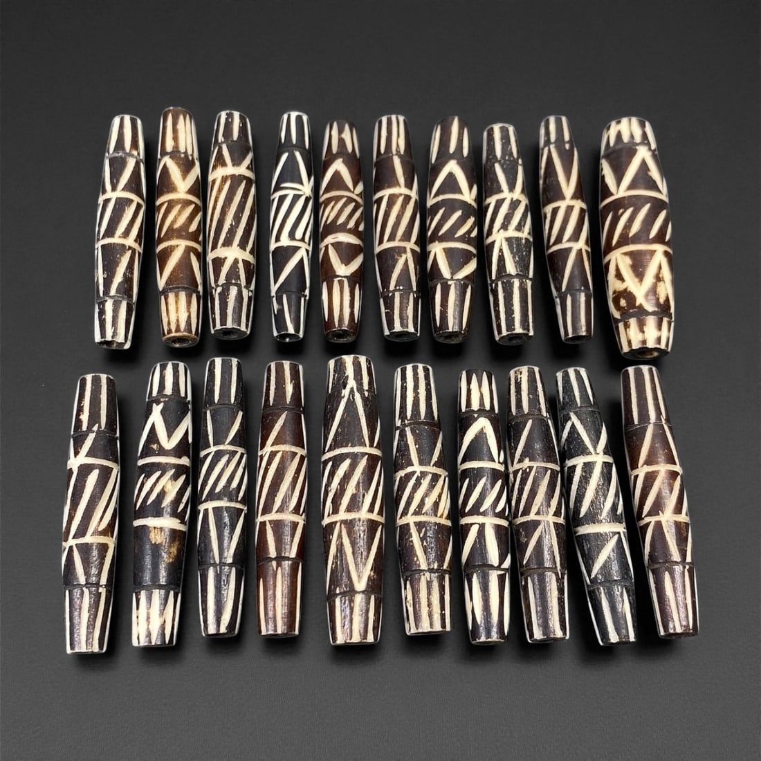 Mid-20th Century Tibetan Hand-Carved Wood Beads, 3.7-3.8cm, 93EP: A collection of Tibetan wood beads, each individually carved and polished, showcasing the natural beauty of the dark-stained grain with contrasting pale surface decoration. These mid-century examples 