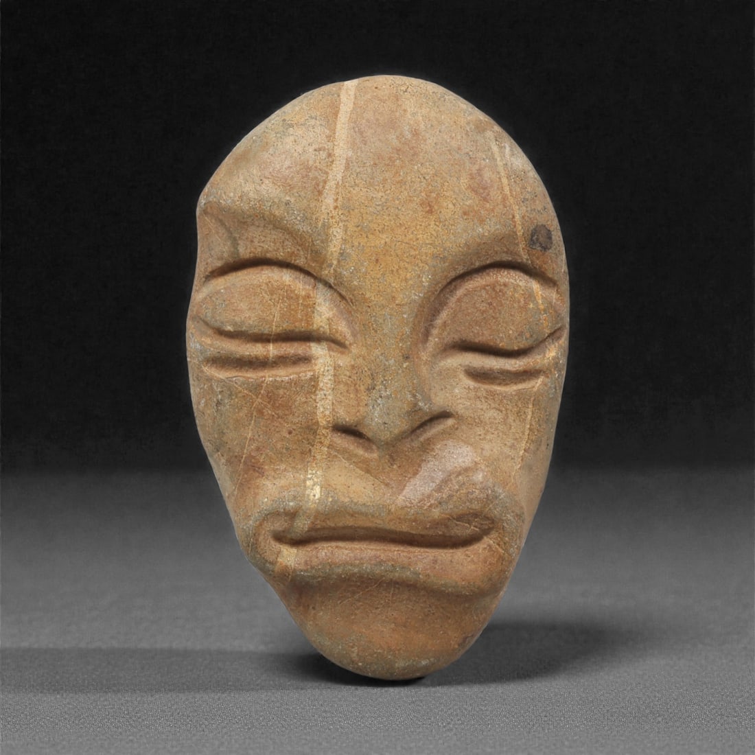 A Mediterranean Stone Maskette, 12th-17th Century, 58AC (1 of 2)