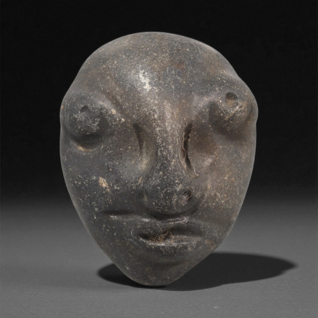 A Mediterranean Stone Maskette, 12th-17th Century, 28LC (1 of 2)