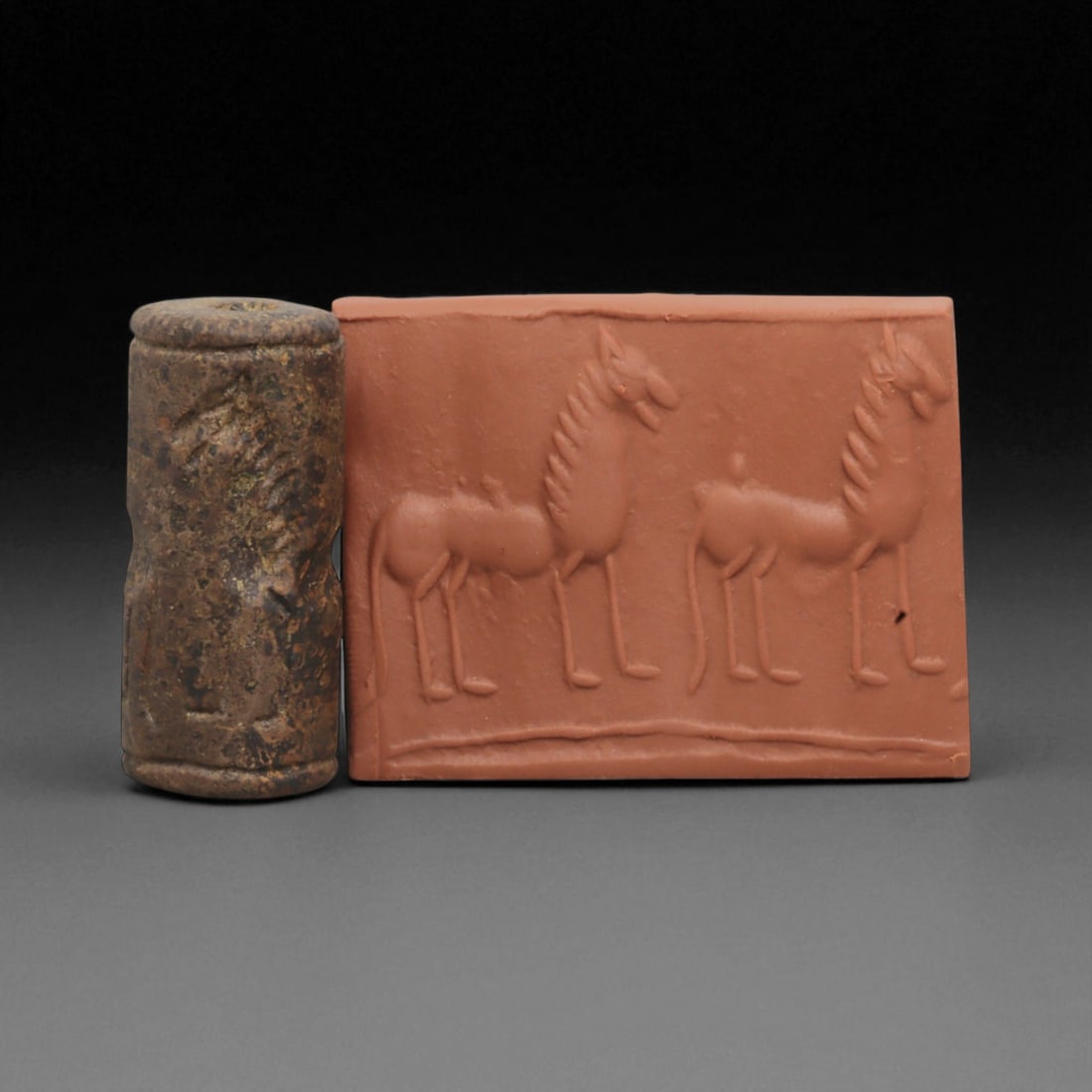 A Mesopotamian Stone Cylinder Seal, 3rd-2nd Millennium BCE, 3.5cm, 77BE: This authentic cylinder seal from ancient Mesopotamia dates to the 2nd to 1st millennium BCE, a time when the art of carving miniature narratives on stone reached remarkable levels of refinement. Seal