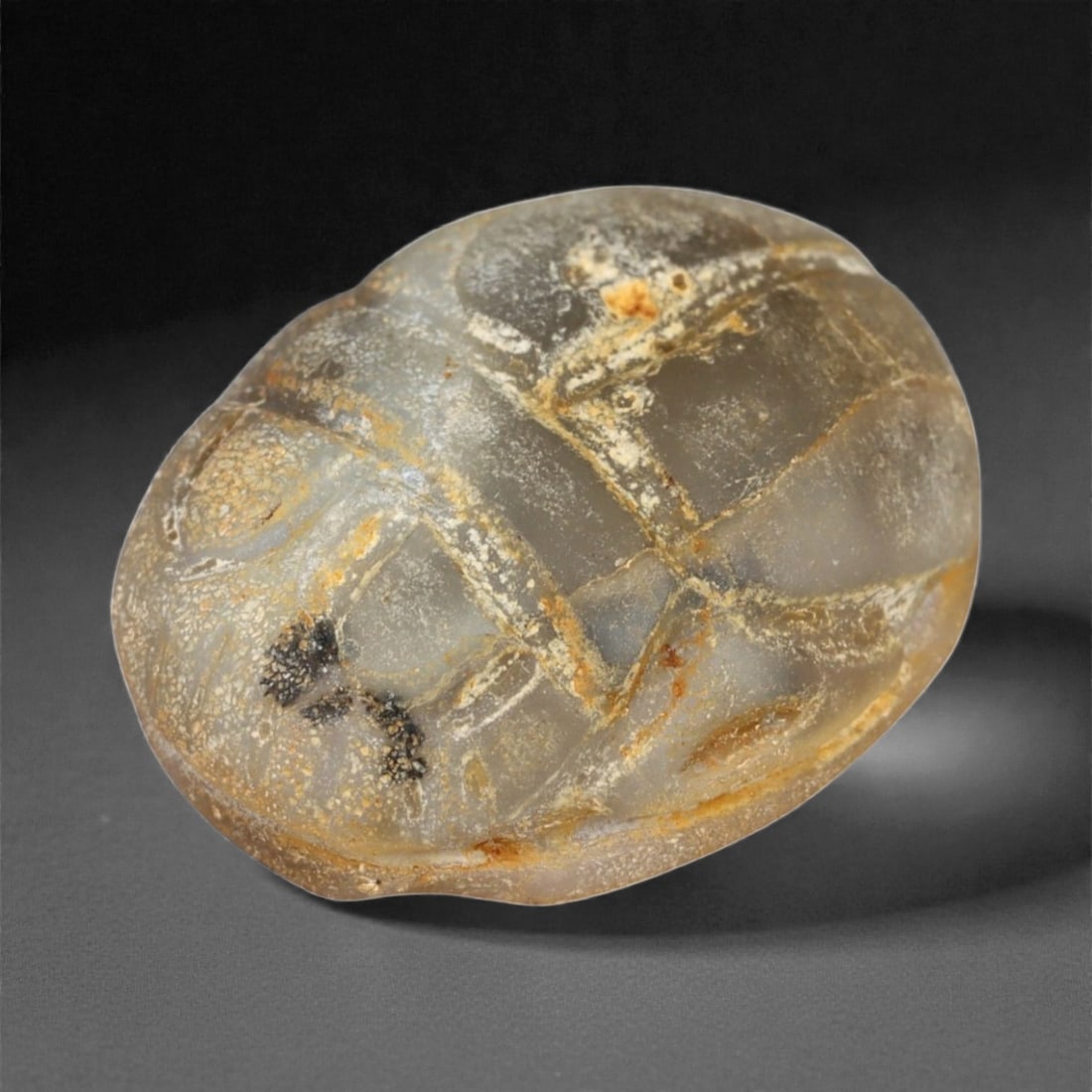 Ancient Egyptian Chalcedony Scarab Amulet, c. Late Period 7th-4th Century BCE (1.8 cm), 66A: This elegant scarab amulet, finely carved from translucent chalcedony with natural veining, dates to Egypt's Late Period, when craftsmanship reached exceptional refinement and spiritual symbolism perm