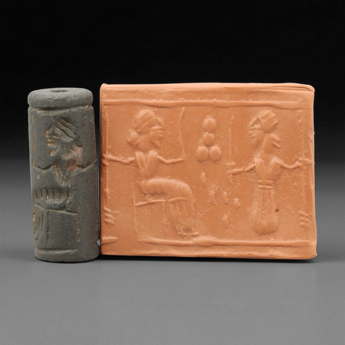 Ancient Mesopotamian Akkadian Steatite Cylinder Seal, c. 2300-2100 BCE, 4.4cm, 37EV: Carved from fine dark steatite, this ancient Akkadian cylinder seal dates to the late 3rd millennium BCE, a period when Mesopotamian artisans perfected the art of miniature relief engraving. Each seal