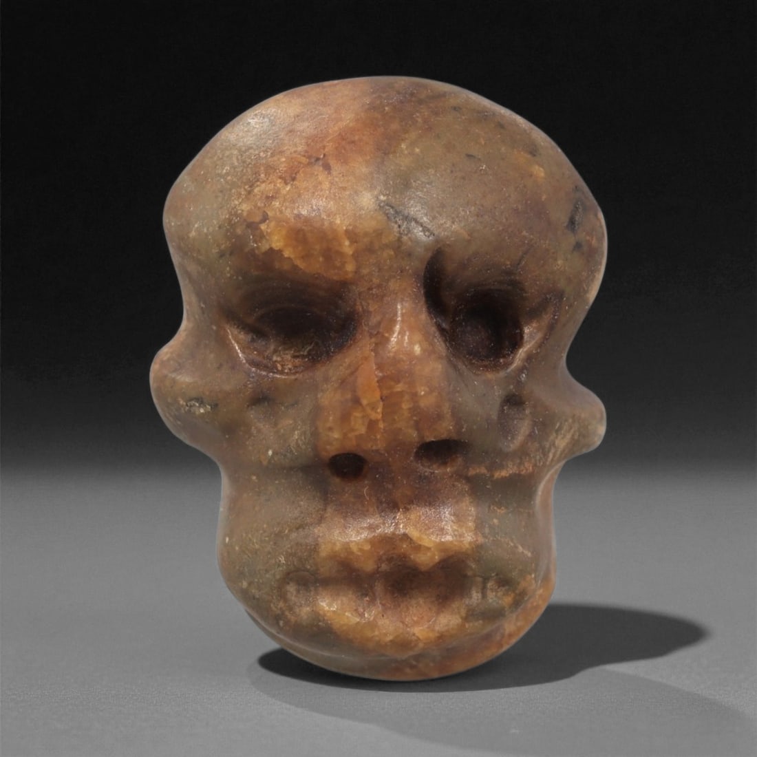 A Mediterranean Stone Maskette, 12th-17th Century, 22LC (1 of 2)