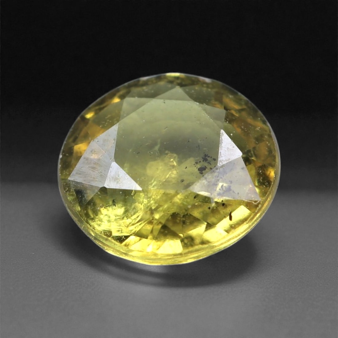 0.96 Carats Lemon Yellow Sapphire - Natural Unheated Madagascan Gem 5x5mm, 12XC: This cheerful yellow sapphire beams with a bright lemon hue, offering a lively and refreshing presence in a compact 5x5 mm frame. Weighing 0.96 carats, the gem features a softly domed crown with a ple