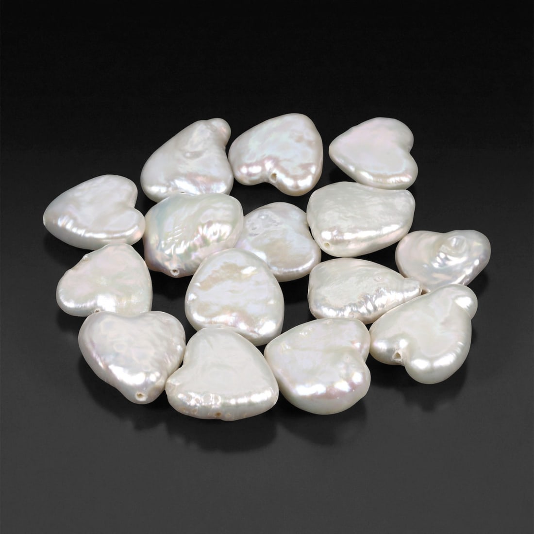 1.00 - 1.80 cm Heart-Shaped Freshwater Pearl Parcel - Natural White Luster, 67XE: This romantic parcel of freshwater pearls features a charming array of heart-shaped forms, each exhibiting a satiny white body color with soft pink and silver overtones. Their surfaces gleam with a ge