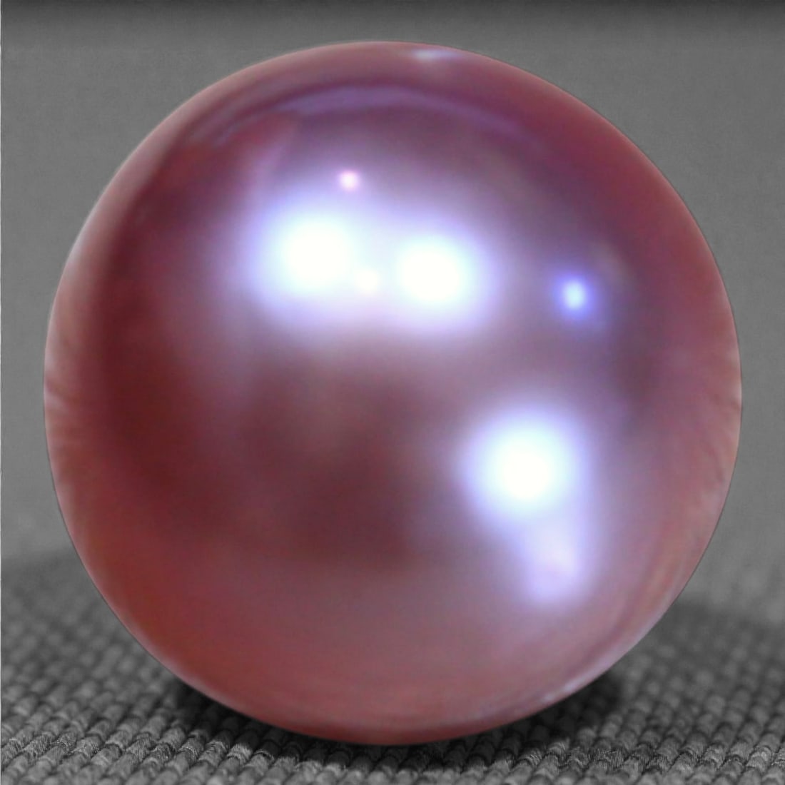 10.57 Carats Violet-Pink Freshwater Pearl - Natural Chinese Gem, 71XB: This exquisite 11.3mm pearl reveals a striking interplay of violet, pink, and silvery overtones, offering a depth of iridescence rarely seen in natural freshwater pearls. Its surface shows gentle orga