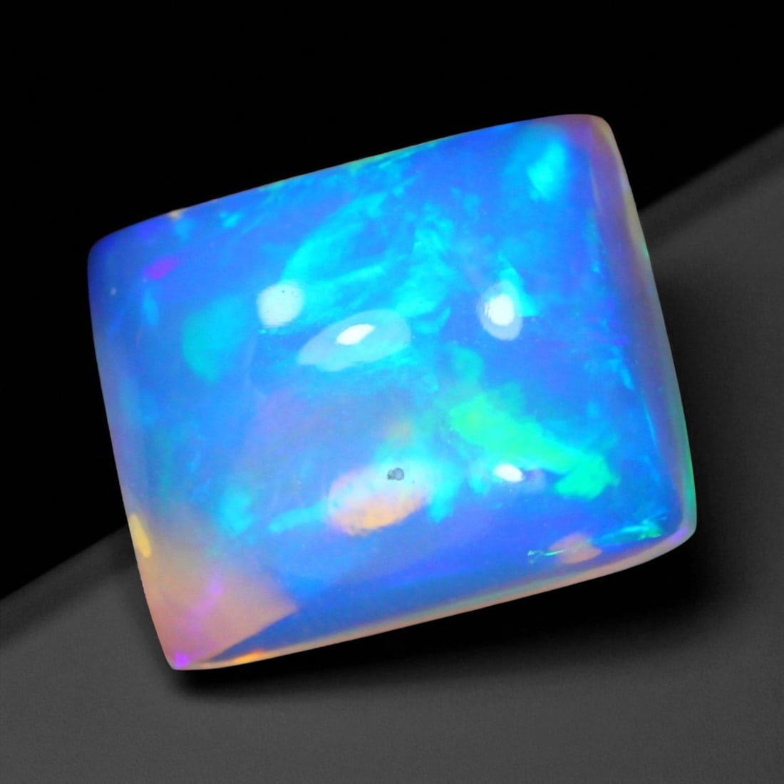 3.42 Carats Multi-Color Welo Opal Lot - Natural Ethiopian Stones, 95XB: This radiant group of Welo opals displays a mesmerizing interplay of color that dances across the surface with every shift of light. Electric flashes of green, orange, and red ripple through a translu