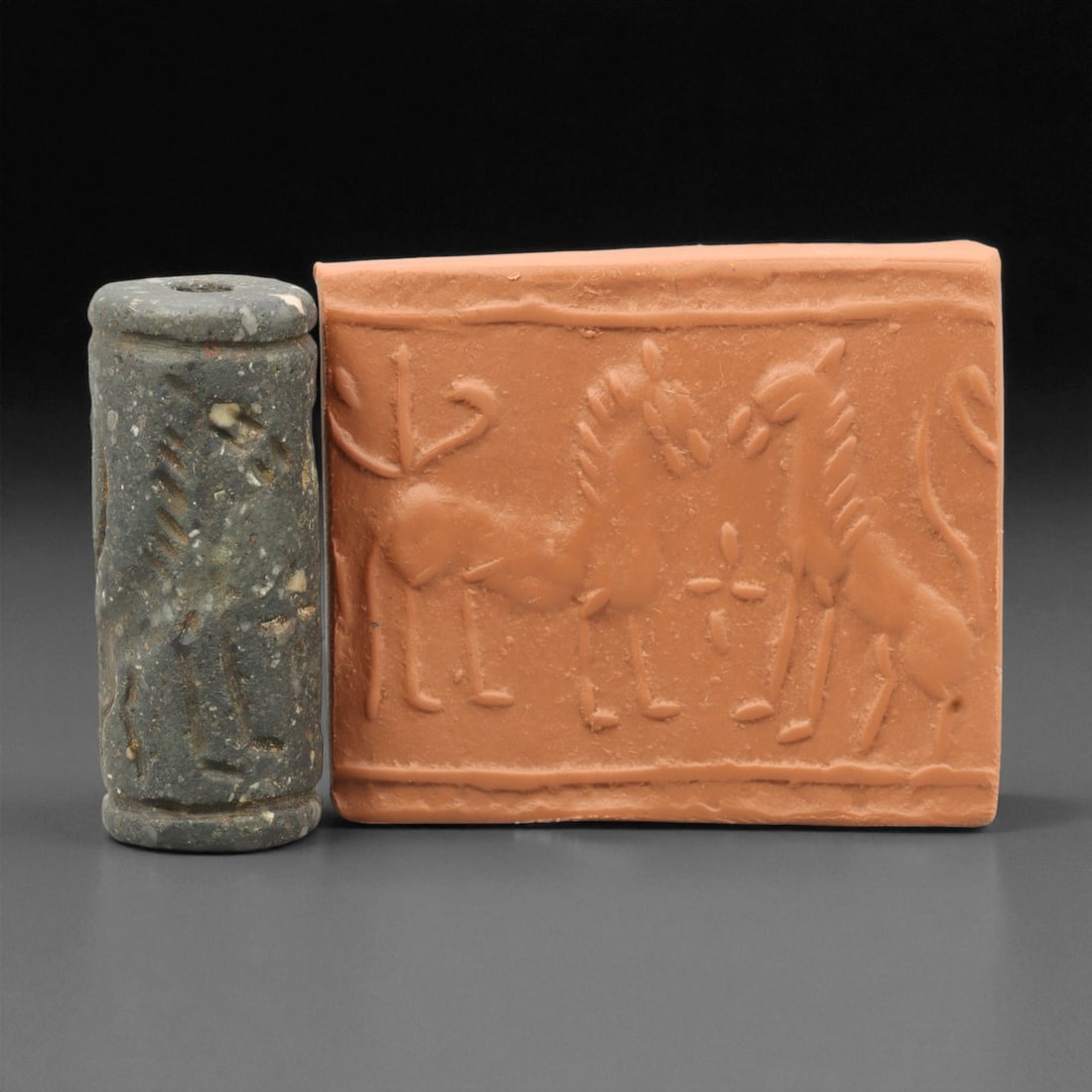 Ancient Mesopotamian Akkadian Steatite Cylinder Seal, c. 2300-2100 BCE, 4.2cm, 69EL: Carved from fine dark steatite, this ancient Akkadian cylinder seal dates to the late 3rd millennium BCE, a period when Mesopotamian artisans perfected the art of miniature relief engraving. Each seal