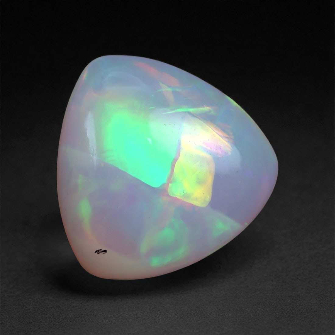 3.05 Carats Play-of-Color Welo Opal - Natural Ethiopian Gem 11x4mm, 36XA: This captivating Welo opal gleams with a luminous cascade of multi neon color that ripple across the stone's surface with every movement. The play-of-color is vivid and well-distributed, presenting a 