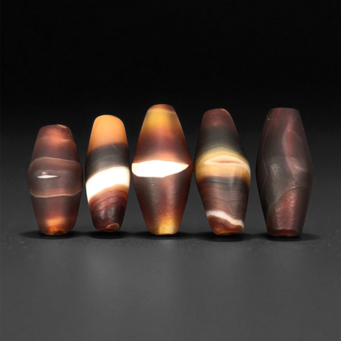 Ancient Persian Banded Agate Barrel Beads c. 1st Mill BCE 2.1-2.2cm, 74ER: These ancient Persian agate beads embody the lapidary sophistication that flourished across early Iranian cultures during the 1st millennium BCE. Their elongated barrel forms highlight the natural ban