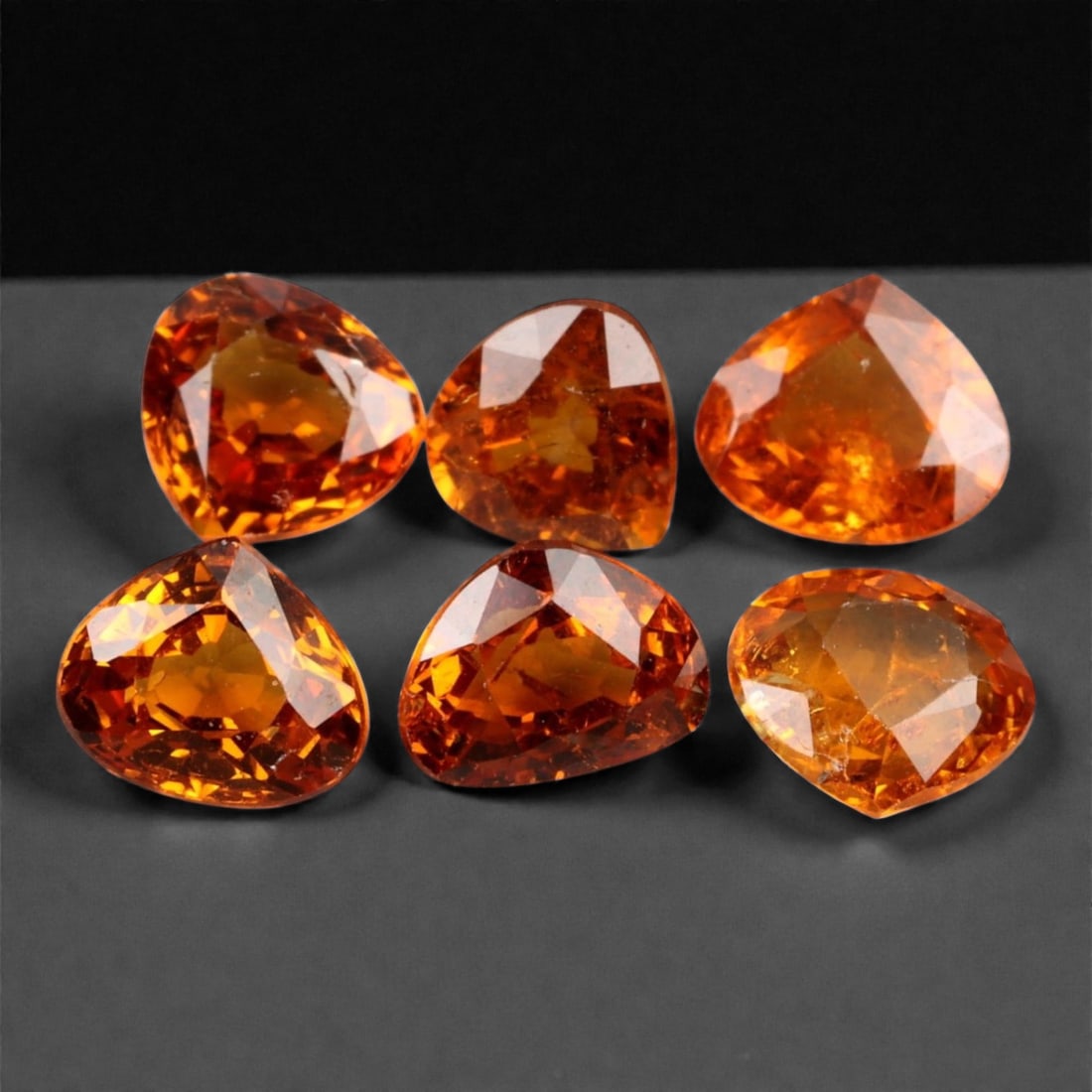 4.23 Carats Golden-Orange Faceted Songea Sapphire Parcel - Natural Tanzanian Stones, 58XA: This vibrant parcel of Songea sapphires glows with a fiery palette ranging from deep amber and burnt orange to bright golden honey tones. Each gem, averaging 5.7x5x2.5 mm, is expertly faceted to maxim