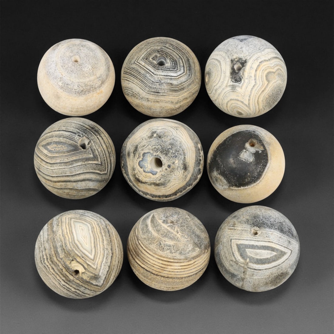 Antique Tibetan Grey Banded Agate Prayer Beads Collection, c. 18th-19th Century, 1.6-1.8cm, 31EM: This refined collection of antique agate beads, dating to the 18th-19th century, originates from the Tibetan Himalayan region. Each bead is beautifully shaped and hand-drilled from naturally banded ag