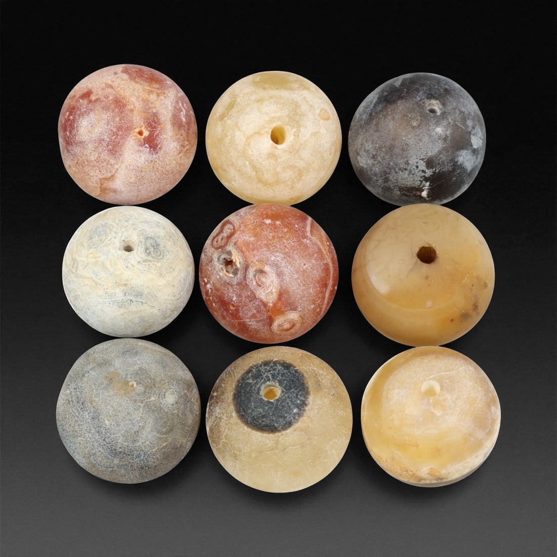 Antique Tibetan Carnelian and Agate Beads, c. 18th-19th Century, 1.7-2cm, 64BD: This fine group of antique Tibetan beads, carved from carnelian and agate, dates to the 18th-19th century. Each spherical bead displays unique natural banding and earthy translucence, ranging in color