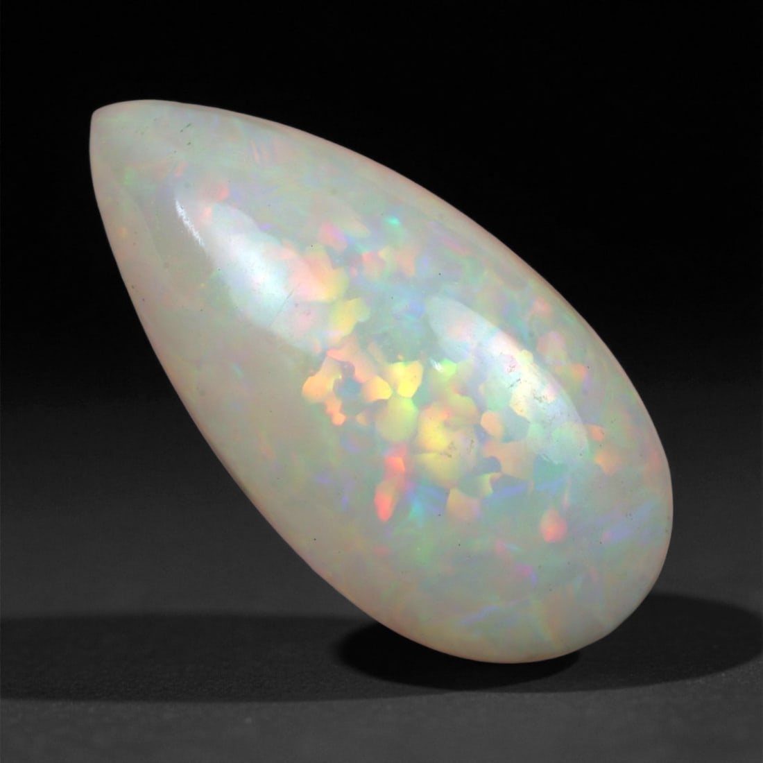 7.38 Carats Multicolor Opal Selection - Natural Welo Ethiopian Stones, 19XC: This luminous selection of Welo opals dazzles with vibrant play-of-color, ranging from electric greens and cobalt blues to sunlit oranges and flashes of violet. Each cabochon has been hand-selected fo