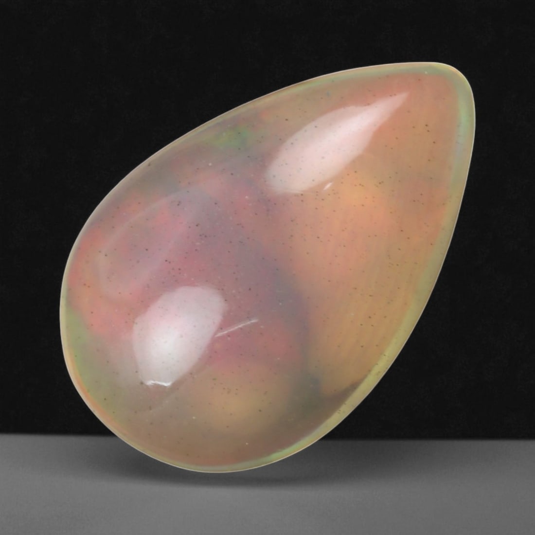 3.49 Carats Multi-Color Welo Opal Lot - Natural Ethiopian Stones, 55WE: This radiant group of Welo opals displays a mesmerizing interplay of color that dances across the surface with every shift of light. Electric flashes of green, orange, and red ripple through a translu
