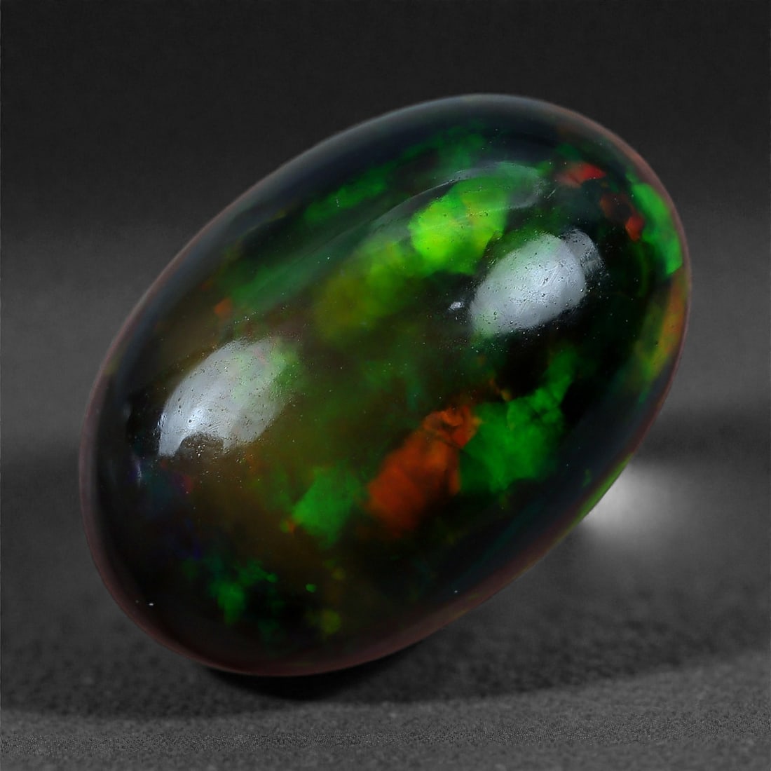 1.92 Carats Natural Welo Origin Smoked Black Opal Cabochon Gems, 11x8mm, 98XA: This natural smoked black opal hails from the Welo region of Ethiopia, a source renowned for producing some of the world's most visually captivating opals. Through a careful and controlled smoking pro