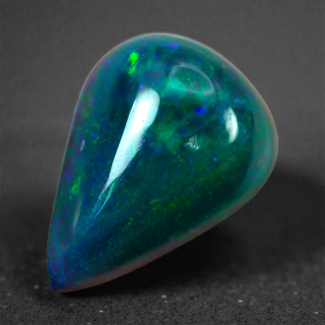 2.20 Carats Natural Welo Origin Smoked Black Opal Cabochon Gems, 11mm, 27M: This natural smoked black opal hails from the Welo region of Ethiopia, a source renowned for producing some of the world's most visually captivating opals. Through a careful and controlled smoking pro
