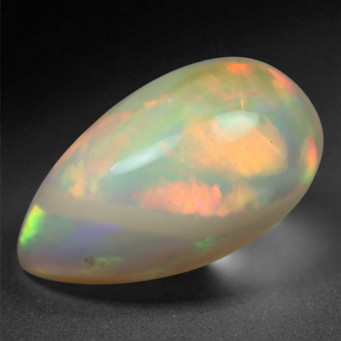 9.66 Carats Multi-Color Welo Opal Lot - Natural Ethiopian Stones, 38XA: This radiant group of Welo opals displays a mesmerizing interplay of color that dances across the surface with every shift of light. Electric flashes of green, orange, and red ripple through a translu
