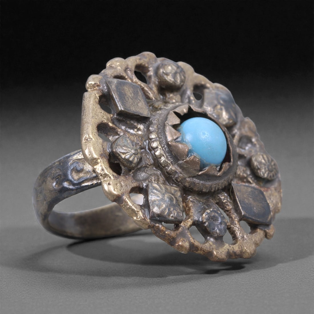 Silver Turquoise Ring - Himalayan Cluster Jewelry, 58X: The ring is constructed from silver, formed into a compact circular cluster with openwork construction and applied decorative elements. At the center is a small turquoise cabochon set in a toothed bez