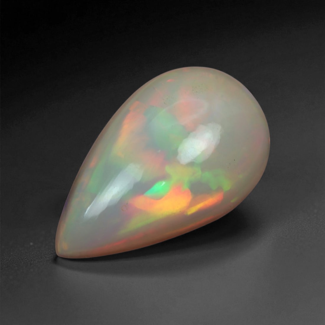 5.04 Carats Multicolor Opal Selection - Natural Welo Ethiopian Stones, 1XB: This luminous selection of Welo opals dazzles with vibrant play-of-color, ranging from electric greens and cobalt blues to sunlit oranges and flashes of violet. Each cabochon has been hand-selected fo