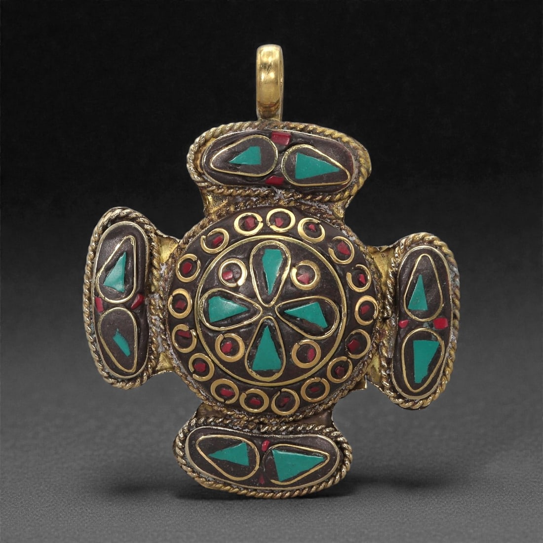 Himalayan Style Brass Pendant - Turquoise Coral Cross, 62XF: This cross-shaped pendant is fashioned in brass and centered on a circular medallion inlaid with turquoise segments arranged in a radiating petal motif. Surrounding the central field is a band of smal