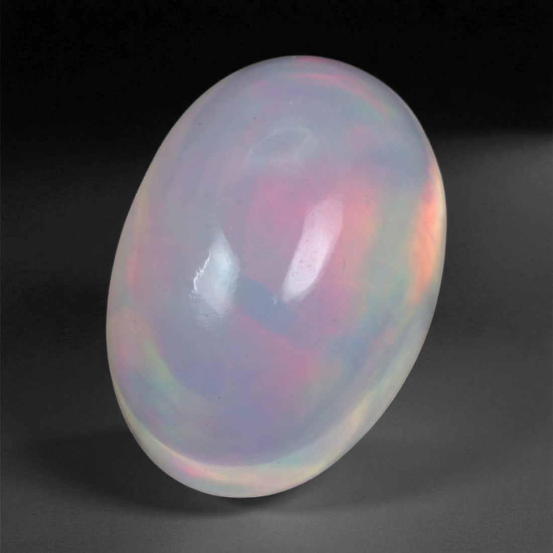 6.30 Carats Multicolor Opal Selection - Natural Welo Ethiopian Stones, 20XB: This luminous selection of Welo opals dazzles with vibrant play-of-color, ranging from electric greens and cobalt blues to sunlit oranges and flashes of violet. Each cabochon has been hand-selected fo