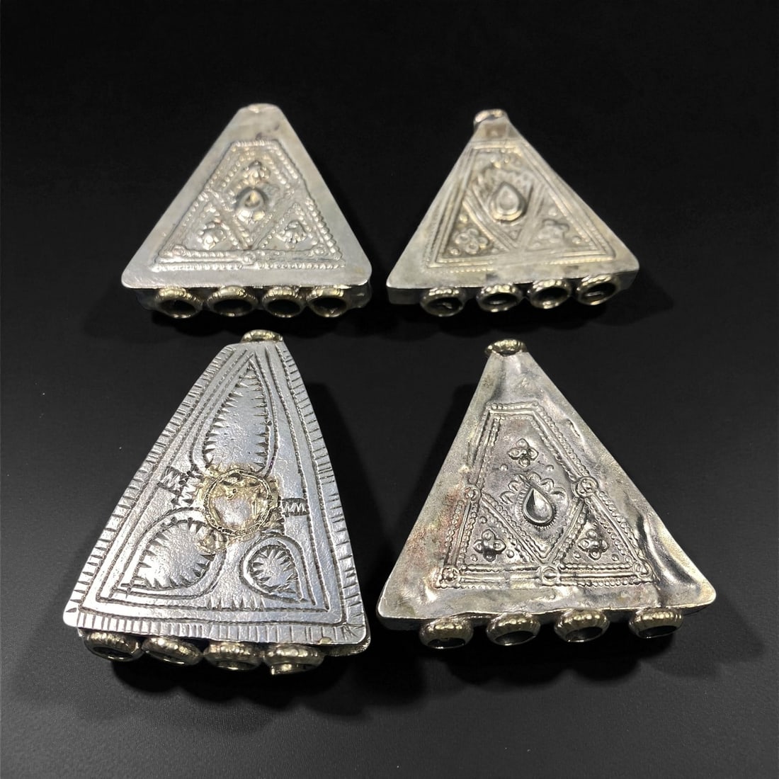 Antique Himalayan Silver Alloy Amulet Box Pendants Set, c. 19th-20th Century, 4.6-5.1cm, 41ES: This captivating set of antique Himalayan amulet boxes, dating to the 19th-20th century, represents the region's deep spiritual and artistic heritage. Crafted in silver alloy, these pendants reflect a