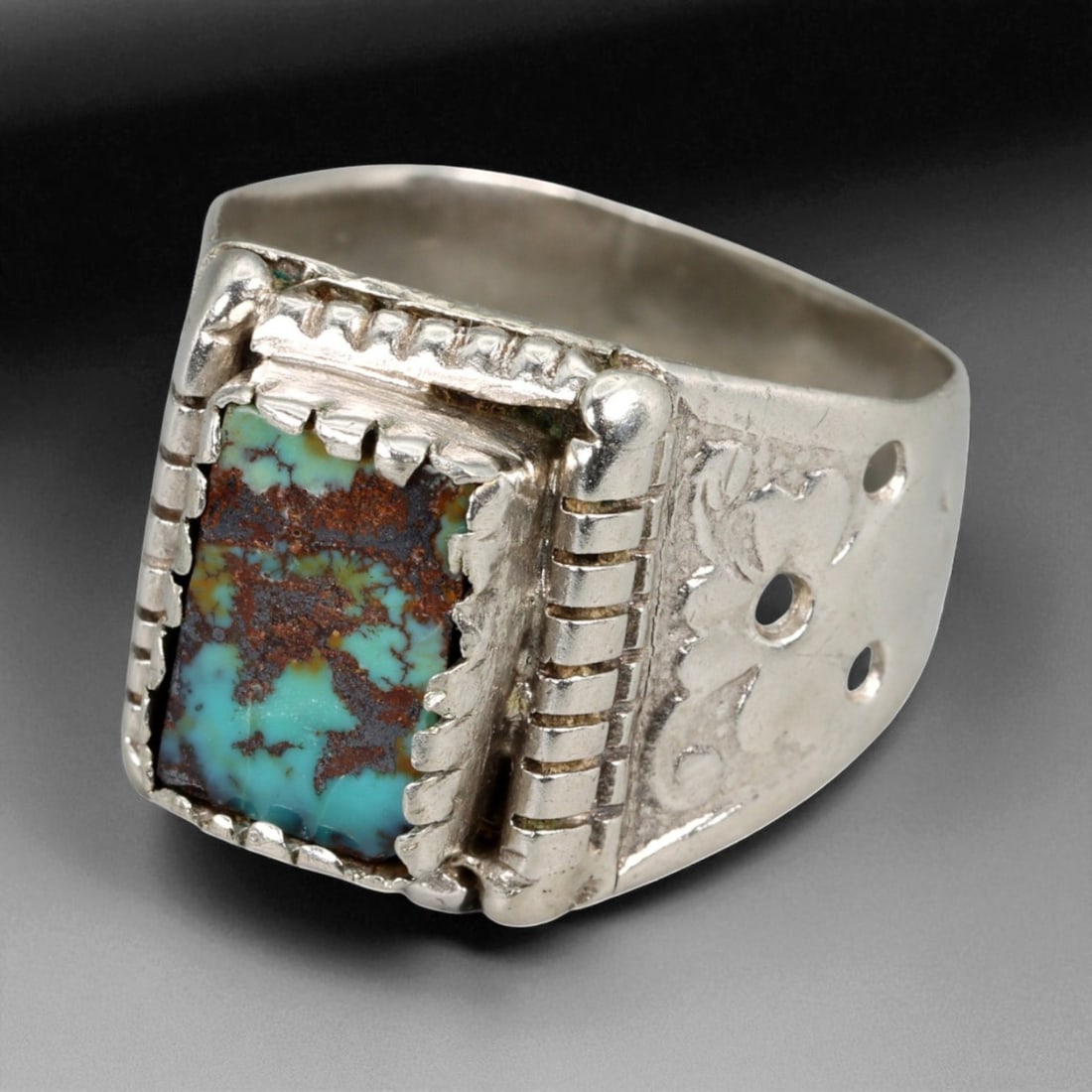 A Central Asian Silver Ring with Rectangular Turquoise Inlay, c. 19th-20th Century, 10 US, 100BA: This bold A silver ring represents the distinctive character of Central Asian craftsmanship from the late 19th to early 20th century. Its rectangular turquoise inlay, marked with a vivid blend of azur