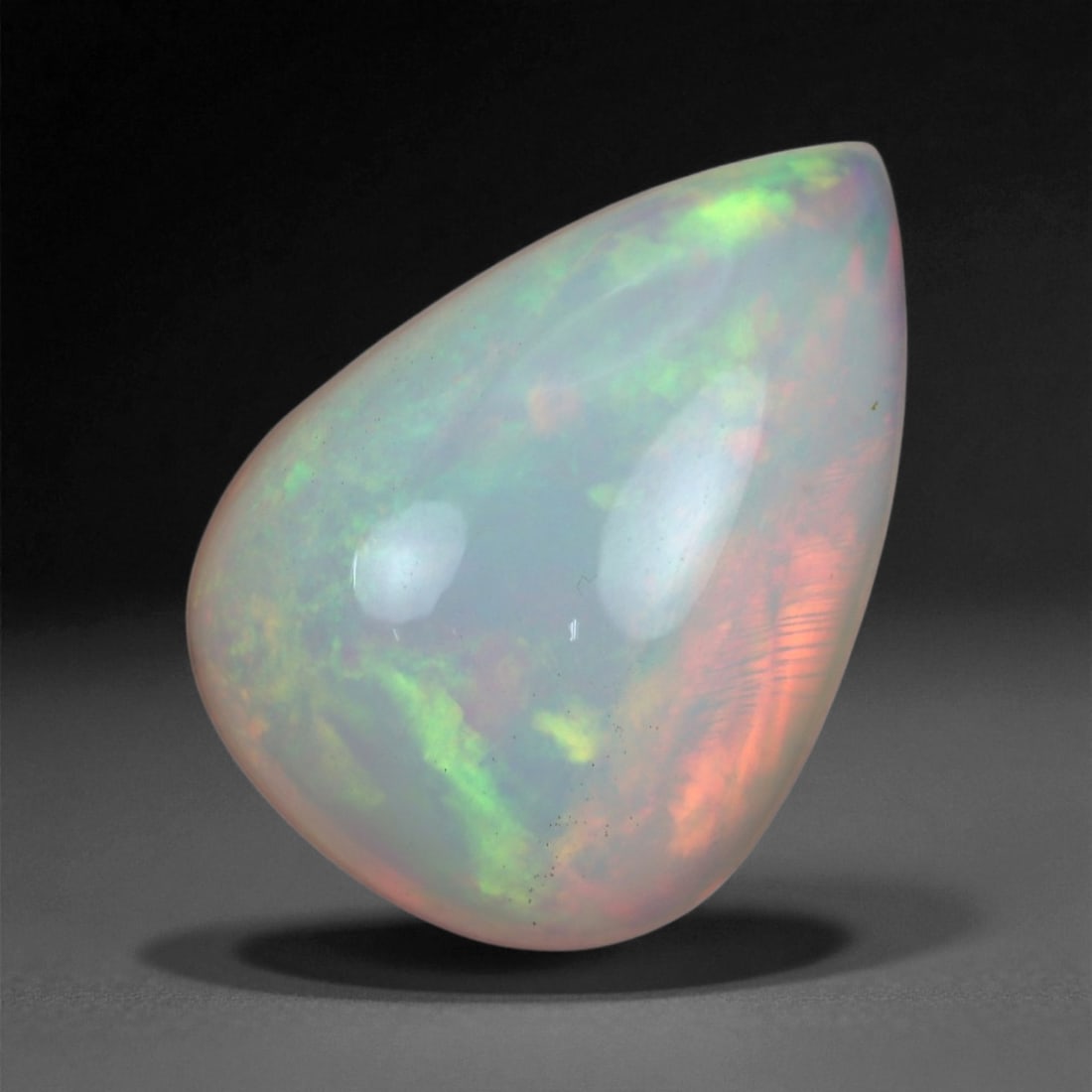 5.31 Carats Multicolor Opal Selection - Natural Welo Ethiopian Stones, 75XB: This luminous selection of Welo opals dazzles with vibrant play-of-color, ranging from electric greens and cobalt blues to sunlit oranges and flashes of violet. Each cabochon has been hand-selected fo