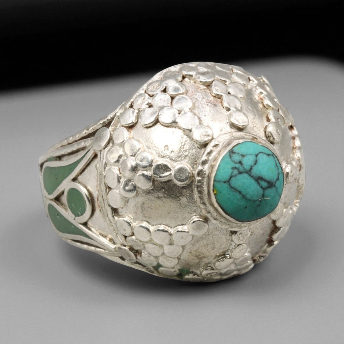 Antique Central Asian Turquoise Dome Silver Ring, c. 19th-20th Century, US 9.5, 62BD: This remarkable antique ring embodies the distinctive domed aesthetic of Central Asian silverwork, where geometry and symbolism intertwine in perfect harmony. The raised circular bezel holds a vivid t