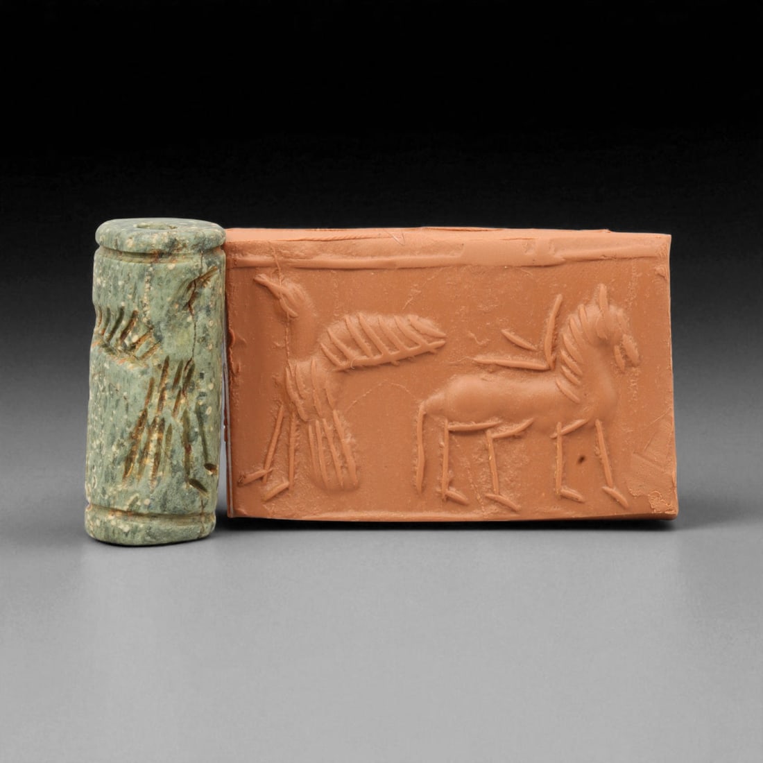 Ancient Mesopotamian Cylinder Seal of Divine Favor, c. 2nd-1st Millennium BCE, 3.7cm, 88K: A striking relic from the dawn of civilization, this ancient Mesopotamian cylinder seal dates to the 2nd-1st millennium BCE - a period when art, writing, and ritual became inseparable expressions of c