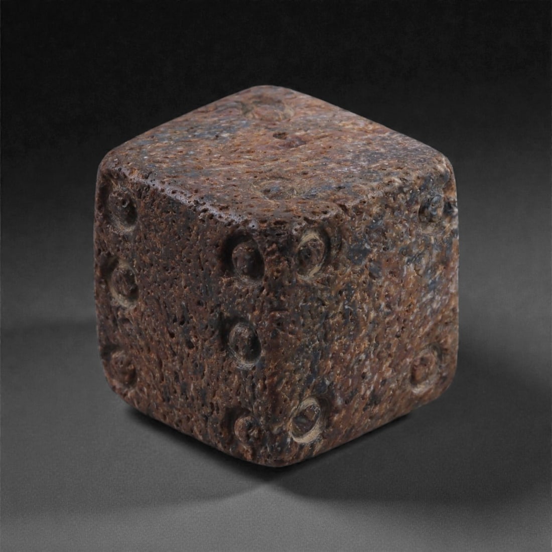 Ancient Roman Bone Gaming Die - Carved Dice, 1.7cm, 27F: Carved from dense animal bone, this miniature gaming die is carefully shaped into a cubic form with evenly proportioned faces and rounded edges softened through long use. The pips are drilled as shall