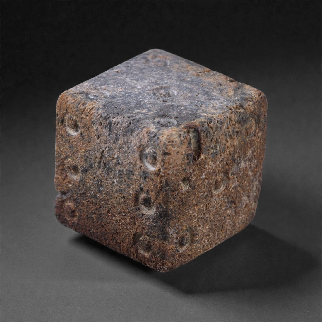 Ancient Roman Bone Gaming Die - Carved Dice, 2.1cm, 37E: Carved from dense animal bone, this miniature gaming die is carefully shaped into a cubic form with evenly proportioned faces and rounded edges softened through long use. The pips are drilled as shall
