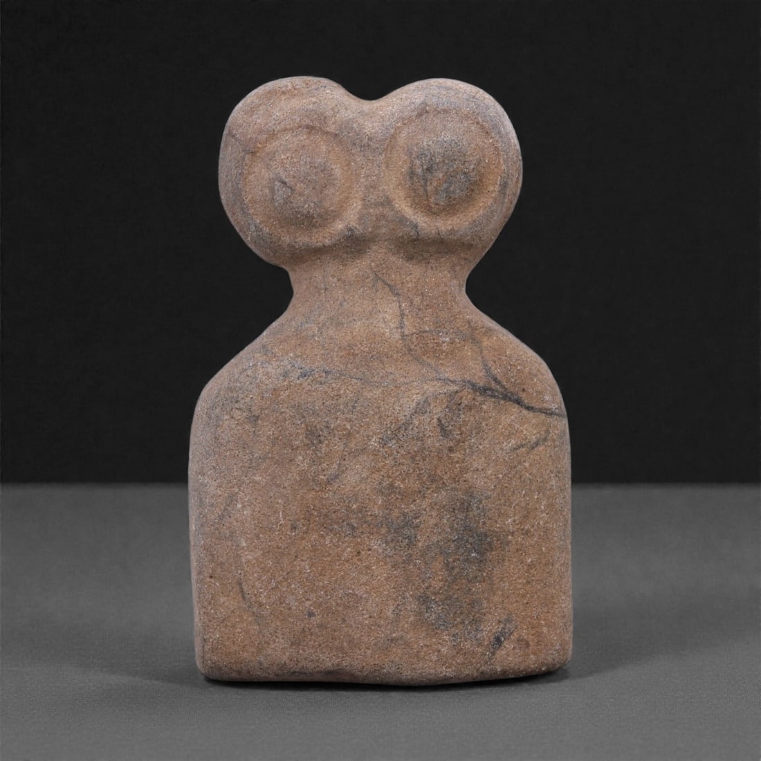 Ancient Stone Eye Idol - Near Eastern Ritual Figurine, 92F: Carved from a compact block of fine-grained stone, this miniature eye idol is worked in the round with careful attention to symmetry and proportion. The surface is smoothly finished, relying on shallo