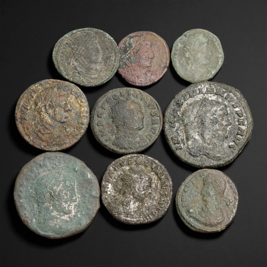 Ancient Roman Imperial Bronze AE Coins, c. 2nd-4th Century CE, 1.7-2.7 cm, 1EN: This collection of nine bronze AE coins spans the height and decline of the Roman Empire, dating approximately between the 2nd and 4th centuries CE. Struck across imperial mints from Rome to Antioch,