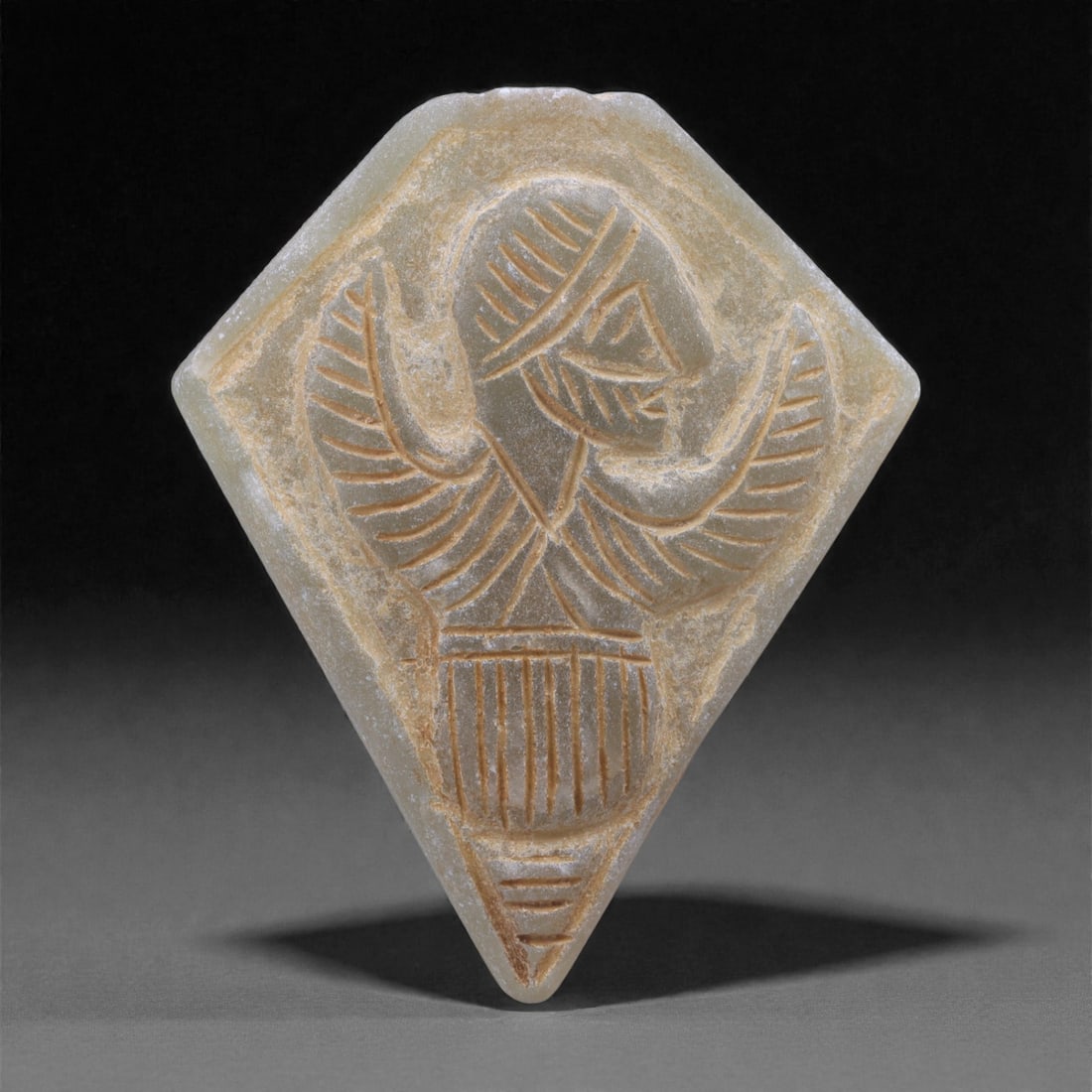 A Near Eastern Chalcedony Winged Figure Amulet, Early 1st Millennium BCE, 67N