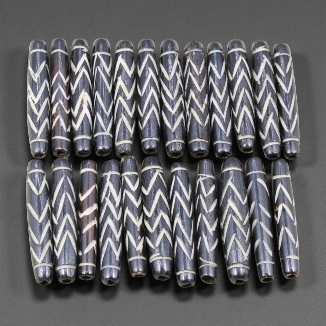 Mid-20th Century Tibetan Hand-Carved Wood Beads, 3.6-3.8cm, 25EJ: A collection of Tibetan wood beads, each individually carved and polished, showcasing the natural beauty of the dark-stained grain with contrasting pale surface decoration. These mid-century examples